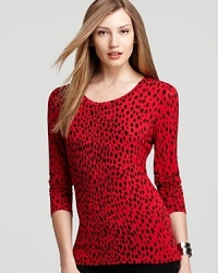 Take a walk on the wild side in a sleek Isaac Mizrahi Jeans top in crisp cheetah print. Take a walk on the wild side in a sleek Isaac Mizrahi Jeans top in crisp cheetah print.