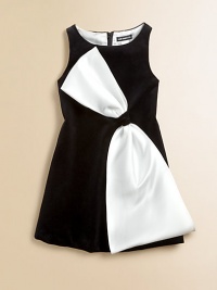 Crafted in a classic shift silhouette, this charming, sleeveless, velvet frock is complimented by an eye-catching bow.BoatneckSleevelessBack zipperBow detail at waistbandFully linedCottonDry cleanImported Crafted in a classic shift silhouette, this charming, sleeveless, velvet frock is complimented by an eye-catching bow.BoatneckSleevelessBack zipperBow detail at waistbandFully linedCottonDry cleanImported