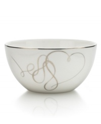 Sweet yet sophisticated, a loopy heart design sweeps across this white porcelain fruit bowl from Mikasa. Complete with a sparkling platinum rim, this flirty ribbon pattern captivates everyone at your dinner table. Sweet yet sophisticated, a loopy heart design sweeps across this white porcelain fruit bowl from Mikasa. Complete with a sparkling platinum rim, this flirty ribbon pattern captivates everyone at your dinner table.