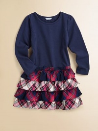 A solid top meets a plaid, ruffled skirt for a frock that transcends perfectly from daytime to dinner.Round necklineShort puffed sleevesPullover styleDrop-waistFull skirtRuffled hemBodice: 95% cotton/5% spandexSkirt: 65% polyester/35% rayonMachine washImported A solid top meets a plaid, ruffled skirt for a frock that transcends perfectly from daytime to dinner.Round necklineShort puffed sleevesPullover styleDrop-waistFull skirtRuffled hemBodice: 95% cotton/5% spandexSkirt: 65% polyester/35% rayonMachine washImported