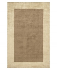 Timeless allure. This attractive area rug illuminates your home with warm mocha-brown color, offset by a refined beige-toned border. Hand-tufted and hand-carved with plush Chinese wool, the rug offers splendid softness and a deep finish that rivals the finest Tibetan weaves. Timeless allure. This attractive area rug illuminates your home with warm mocha-brown color, offset by a refined beige-toned border. Hand-tufted and hand-carved with plush Chinese wool, the rug offers splendid softness and a deep finish that rivals the finest Tibetan weaves.