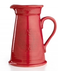 Homegrown style. An organic shape and engraved florals give the Espana Antica pitcher a handcrafted feel that suits country settings. With a glossy red finish. From the Tabletops Unlimited dinnerware collection. Homegrown style. An organic shape and engraved florals give the Espana Antica pitcher a handcrafted feel that suits country settings. With a glossy red finish. From the Tabletops Unlimited dinnerware collection.