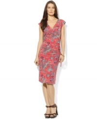 A bold, bright paisley print enlivens this petite feminine dress from Lauren by Ralph Lauren in breezy stretch jersey, tailored in a flattering faux-wrap silhouette for a chic, modern look. A bold, bright paisley print enlivens this petite feminine dress from Lauren by Ralph Lauren in breezy stretch jersey, tailored in a flattering faux-wrap silhouette for a chic, modern look.