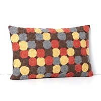 Reminiscent of handcrafted textiles, this Sky decorative pillow brings a contemporary pop of color to your home with rows of vibrant spiral twists.