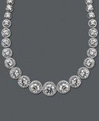 A chic collar perfect for cocktail hour. Arabella's dazzling design highlights dozens of round-cut Swarovski zirconias (55-1/3 ct. t.w.) set in sterling silver. Approximate length: 17 inches.