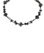In the black: Embellished with jet enamel beads, 2028's necklace is a versatile style that will look great day and night. Crafted in mixed metal. Approximate length: 16 inches + 3-inch extender.