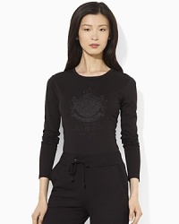 A long-sleeved cotton tee is given a luxurious update, finished with an embroidered and beaded crest at the front. A long-sleeved cotton tee is given a luxurious update, finished with an embroidered and beaded crest at the front.