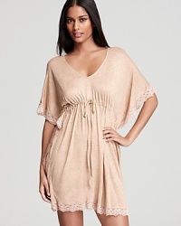 Midnight by Carole Hochman's caftan features a drawstring waist for a flattering fit and lace trim for an elegant touch. Midnight by Carole Hochman's caftan features a drawstring waist for a flattering fit and lace trim for an elegant touch.
