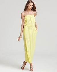 The sunny hue of this floor-sweeping Velvet by Graham & Spencer strapless dress reflects the cheerful attitude of summer style. The sunny hue of this floor-sweeping Velvet by Graham & Spencer strapless dress reflects the cheerful attitude of summer style.