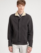 A casual wardrobe staple, this zip-up jacket breathes new life to an old favorite; crafted in a supremely soft cotton blend with a faux-sherpa lining at the collar and cuffs for the ultimate experience of style and comfort.Zip frontSnap-button placketSide slash pockets85% cotton/15% polyesterMachine washImported