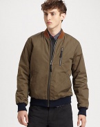 Beat the season's elements in style with this jersey-lined nylon jacket with contrast collar and hem and leather detail.Zip frontZippered chest, waist slash pocketsRibbed knit cuffs and hemAbout 27 from shoulder to hem62% nylon/38% cottonDry cleanImported