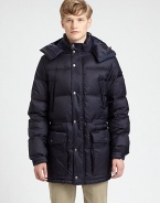 Remain cozy and dry all season long in this quilted nylon puffer, with down-fill for added warmth and large, over-sized pockets to secure all of your personal essentials.Zip-frontRemovable hoodChest slash, waist flap pocketsElasticized waistAbout 33 from shoulder to hemNylonDry cleanImported