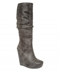 Hit the city streets with edgy, downtown style. The Nya wedge boots by Jessica Simpson feature fashion-forward touches like a pointed toe and slouchy shaft. Hit the city streets with edgy, downtown style. The Nya wedge boots by Jessica Simpson feature fashion-forward touches like a pointed toe and slouchy shaft.