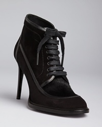 The granny bootie just got a high-fashion makeover, Burberry style, in these wickedly witchy and alluring lace up high heels. The granny bootie just got a high-fashion makeover, Burberry style, in these wickedly witchy and alluring lace up high heels.