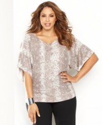 Channel your wild side in INC's snakeskin-print plus size top, complete with shining sequins. In a dolman-sleeve silhouette and neutral palette, it makes just the right impact. (Clearance)