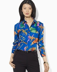 Touches of menswear styling distinguish this heritage-inspired shirt, tailored in smooth silk and finished with an equestrian-inspired print for a sleek feminine balance. Touches of menswear styling distinguish this heritage-inspired shirt, tailored in smooth silk and finished with an equestrian-inspired print for a sleek feminine balance.