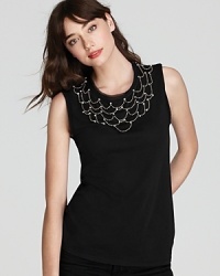 Dripping with decadence, this Juicy Couture tank flaunts a drapery of silver beading studded with statement crystal embellishment for a luxe look. Dripping with decadence, this Juicy Couture tank flaunts a drapery of silver beading studded with statement crystal embellishment for a luxe look.