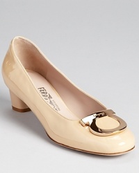 A classic shoe for the polished professional, these Ferragamo pumps offer a moderate heel--the perfect ingredient for all day wear. A classic shoe for the polished professional, these Ferragamo pumps offer a moderate heel--the perfect ingredient for all day wear.
