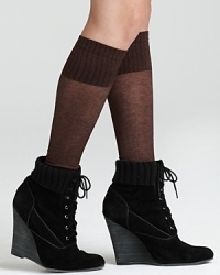 Lightweight melange boot toppers feature ribbed trim and a footless silhouette. Lightweight melange boot toppers feature ribbed trim and a footless silhouette.