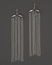 Silver and gold mingle with a dramatic fall of chains. By Gurhan. Silver and gold mingle with a dramatic fall of chains. By Gurhan.