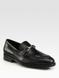 Slip-on moccasin of Italian calfskin leather exudes refined luxury, detailed with signature gancini ornament and a rubber sole for a relaxed, comfortable fit.Leather upperLeather liningPadded insoleRubber soleMade in Italy Slip-on moccasin of Italian calfskin leather exudes refined luxury, detailed with signature gancini ornament and a rubber sole for a relaxed, comfortable fit.Leather upperLeather liningPadded insoleRubber soleMade in Italy