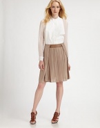 Crisply-tailored cotton poplin finished with plisse pleats, a flared hem and silk chiffon sleeves.Band collarPleated button-down placketSilk chiffon sleeves and side insetsInverted back pleatAbout 38 from shoulder to hemBody: cotton; sleeves: silkDry cleanMade in USAModel shown is 5'10½ (179cm) wearing US size 4.