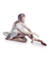 To the point. This elegant ballet dancer from Lladro extends her toes in a graceful stretch, holding the pose and a single rose, in handcrafted porcelain.