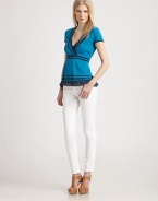 Delicate eyelet trims this flattering surplice top knit from a luxe blend of silk, linen and cotton.Short sleevesSurplice bodiceEmpire waistlace hemAbout 24 from shoulder to hem40% silk/30% linen/30% cottonDry cleanImportedModel shown is 5'10 (177cm) wearing US size Small.
