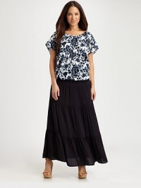 Silky jersey creates the perfect backdrop to this tiered skirt with a comfortable, elasticized waistband.Elasticized waistbandSoft pleatsRuffle hemAbout 40 longRayonDry cleanImported Silky jersey creates the perfect backdrop to this tiered skirt with a comfortable, elasticized waistband.Elasticized waistbandSoft pleatsRuffle hemAbout 40 longRayonDry cleanImported