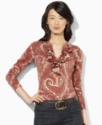 Rendered in a lightweight cotton knit, Lauren Jeans Co.'s soft top features a tiered ruffle trim along the neckline for feminine charm. Rendered in a lightweight cotton knit, Lauren Jeans Co.'s soft top features a tiered ruffle trim along the neckline for feminine charm.