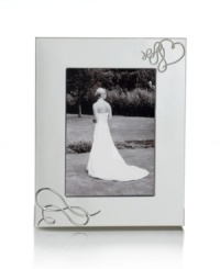 Show your romantic side. Loopy hearts in the silver-plated Love Story picture frame showcase special moments with elegant whimsy. From Mikasa. Show your romantic side. Loopy hearts in the silver-plated Love Story picture frame showcase special moments with elegant whimsy. From Mikasa.