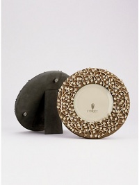 A charming, 14k goldplate floral motif is laid over a suede background, creating an eye-catching, completely handmade frame fit for any treasured photograph. From the Lorel Collection Accommodates a 4 diam. photograph Overall, 7 diam. Imported A charming, 14k goldplate floral motif is laid over a suede background, creating an eye-catching, completely handmade frame fit for any treasured photograph. From the Lorel Collection Accommodates a 4 diam. photograph Overall, 7 diam. Imported