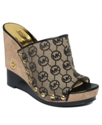 Slip into sophistication. MICHAEL Michael Kors' Belina mules feature a cute designer logo print and a tall platform heel. Slip into sophistication. MICHAEL Michael Kors' Belina mules feature a cute designer logo print and a tall platform heel.