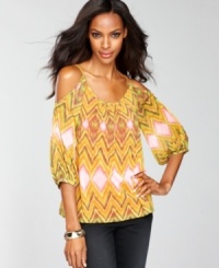 Colorful and more than a little seductive, INC's stylish peasant top combines an exotic print and alluring bare shoulders! Colorful and more than a little seductive, INC's stylish peasant top combines an exotic print and alluring bare shoulders!