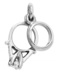 The perfect gift for the bride to be. This sweet charm features a wedding band and engagement ring decorated with a round-cut cubic zirconia accent. Crafted in 14k white gold. Chain not included. Approximate length: 3/5 inch. Approximate width: 3/10 inch. The perfect gift for the bride to be. This sweet charm features a wedding band and engagement ring decorated with a round-cut cubic zirconia accent. Crafted in 14k white gold. Chain not included. Approximate length: 3/5 inch. Approximate width: 3/10 inch.