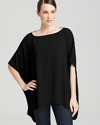 Let casual wear flow free in this DIANE von FURSTENBERG poncho style top. A relaxed, boxy fit speaks to stylish comfort. Let casual wear flow free in this DIANE von FURSTENBERG poncho style top. A relaxed, boxy fit speaks to stylish comfort.