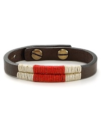 Waxed wraparound threads bring colorful contrast to this naturally smooth, metal-studded Vachetta leather bracelet. Waxed wraparound threads bring colorful contrast to this naturally smooth, metal-studded Vachetta leather bracelet.