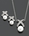 Radiant cultured freshwater pearls (6-8 mm) are hugged by sparkling sterling silver settings dotted with diamond accents on this beautiful pendant and earrings set. Pendant measures approximately 18 inches with a 5/8-inch drop. Earrings measure approximately 1/4 inch.