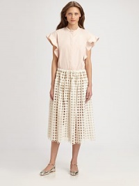 Sculptural ruffled sleeves lend dramatic flair to this crisply tailored piece.Band collarConcealed button frontShort ruffle sleevesCottonDry cleanImportedModel shown is 5'10 (177cm) wearing US size 4. Sculptural ruffled sleeves lend dramatic flair to this crisply tailored piece.Band collarConcealed button frontShort ruffle sleevesCottonDry cleanImportedModel shown is 5'10 (177cm) wearing US size 4.