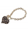 Perfect for prowling. This fierce style from GUESS features a leopard print heart in black enamel and crystal. Setting and cable chain crafted in gold tone mixed metal. Approximate length: 7-1/2 inches.