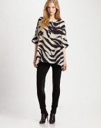 The quintessential combination of wild style and classic luxury, this boxy, animal-print top made from fine silk is the ultimate wardrobe must-have.Round neckElbow-length sleevesButton placketRelaxed fitAllover printPull-on styleAbout 27 from shoulder to hemSilkDry cleanImported Model shown is 5'9½ (176cm) wearing US size Small. 
