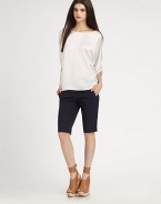 Glistening silk boatneck has three-quarter dolman sleeves and an unanticipated hi-low hem. BoatneckThree-quarter dolman sleevesHi-low hem hits below the hipsSilkDry cleanImportedModel shown is 5'10 (177cm) wearing US size Small.