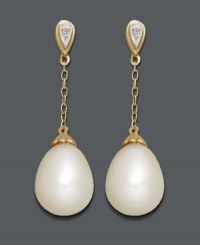 Sophisticated style perfect for the office or an evening out. Elegant drops feature cultured freshwater pearls (8 x 11 mm) strung from delicate chains crafted in 14k gold with sparkling diamond-accented posts. Approximate drop: 1-1/10 inches. Sophisticated style perfect for the office or an evening out. Elegant drops feature cultured freshwater pearls (8 x 11 mm) strung from delicate chains crafted in 14k gold with sparkling diamond-accented posts. Approximate drop: 1-1/10 inches.