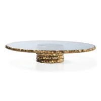 After a hammered edge is carefully created around the circumference of this richly textured glass cake stand, craftsmen hand-paint an opulent band of platinum for a breathtaking finish. After a hammered edge is carefully created around the circumference of this richly textured glass cake stand, craftsmen hand-paint an opulent band of platinum for a breathtaking finish.