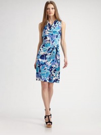 This faux-wrap silhouette features a prettily draped cowl neckline and a vibrant, painterly print.Cowl necklineSleevelessFaux wrap skirt with front tieConcealed back zipAbout 21 from natural waistPolyesterDry cleanMade in USA of imported fabricModel shown is 5'11 (180cm) wearing US size 4. This faux-wrap silhouette features a prettily draped cowl neckline and a vibrant, painterly print.Cowl necklineSleevelessFaux wrap skirt with front tieConcealed back zipAbout 21 from natural waistPolyesterDry cleanMade in USA of imported fabricModel shown is 5'11 (180cm) wearing US size 4.