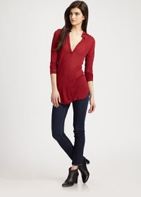 Overwhelmingly soft modal blouse with henley styling and a contour hem that hits below the hips. Stand collarV-neckLong sleevesContour hem hits below the hipsModalDry cleanMade in USAModel shown is 5'10 (177cm) wearing US size Small. Overwhelmingly soft modal blouse with henley styling and a contour hem that hits below the hips. Stand collarV-neckLong sleevesContour hem hits below the hipsModalDry cleanMade in USAModel shown is 5'10 (177cm) wearing US size Small.