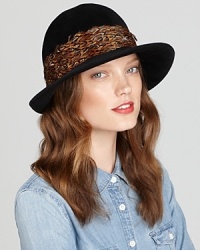 Fabulous pheasant feathers create a colorful, textured band around Eric Javits' hand-blocked velour hat. Fabulous pheasant feathers create a colorful, textured band around Eric Javits' hand-blocked velour hat.