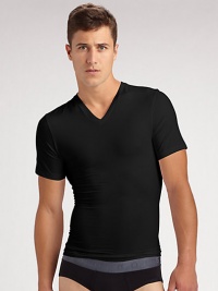 The classic crew is redefined in high-stretch cotton that firms the chest as it flattens the stomach. Crewneck Improves posture Supports lower back No bulk under clothing Tapered shape 81% cotton/19% spandex; machine wash Imported The classic crew is redefined in high-stretch cotton that firms the chest as it flattens the stomach. Crewneck Improves posture Supports lower back No bulk under clothing Tapered shape 81% cotton/19% spandex; machine wash Imported