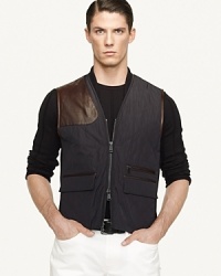 A sleek, modern update on the traditional riding vest, this trim-fitting silhouette is designed in lustrous diamond-quilted microfiber with sumptuous Italian leather accents for a handsome look that's imbued with equestrian heritage. A sleek, modern update on the traditional riding vest, this trim-fitting silhouette is designed in lustrous diamond-quilted microfiber with sumptuous Italian leather accents for a handsome look that's imbued with equestrian heritage.