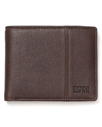 Soft, rich pebbled leather is treated with a matte finish for masculine appeal and classic polish on this everyday essential bi-fold wallet.